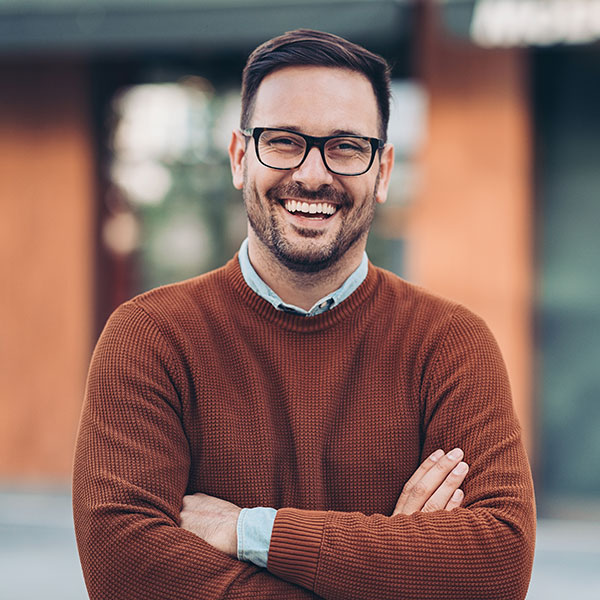 Smiling man outdoors in the city