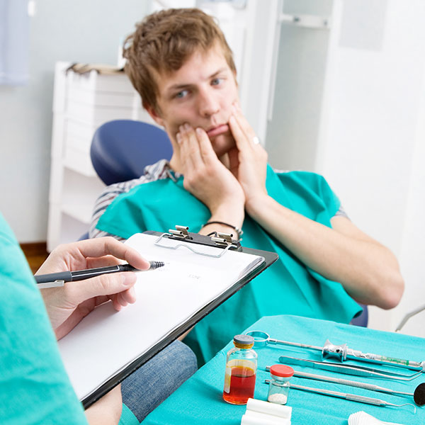 Patient having toothache taking appointment with the dentist